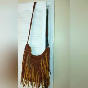 Brown crossbody fringe bag by Charming Charlie 🤎.